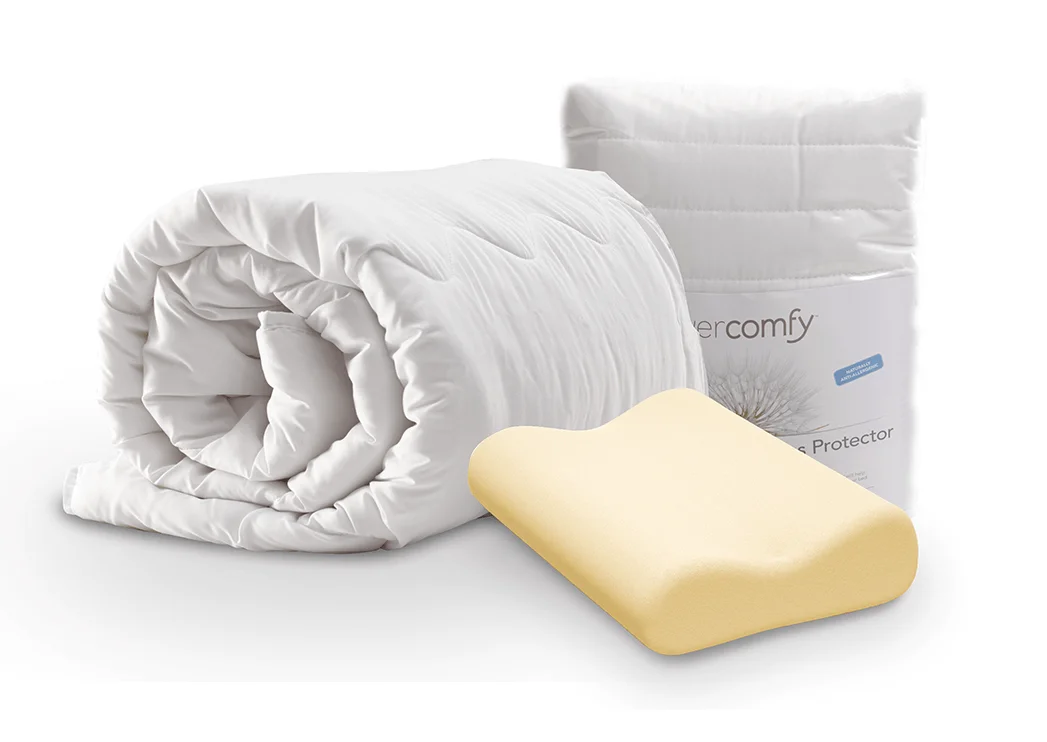 A picture of the Dormeo Autumn/Winter Bedding Bundle. A white Dormeo Memosan Anatomic pillow rests on a white Autumn/Winter 13.5 Tog Evercomfy Dormeo duvet, creating a soft and cozy bedding arrangement. The foam inside of the pillow is also shown. A Dorme