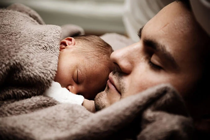 a father and his newborn baby