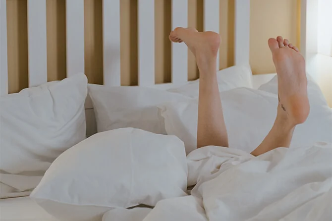Legs sticking out of duvet