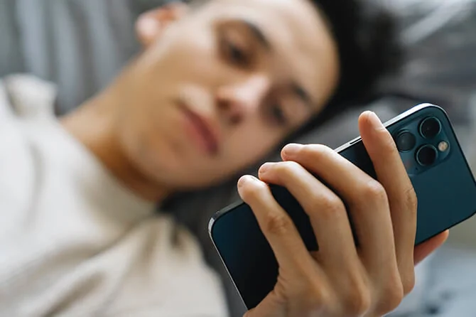 Man scrolling on smartphone