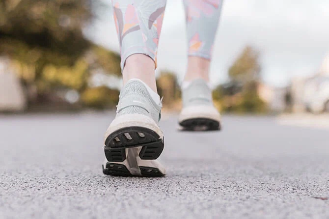 trainers running on a road