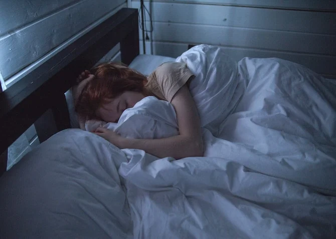 Woman sleeping in bed