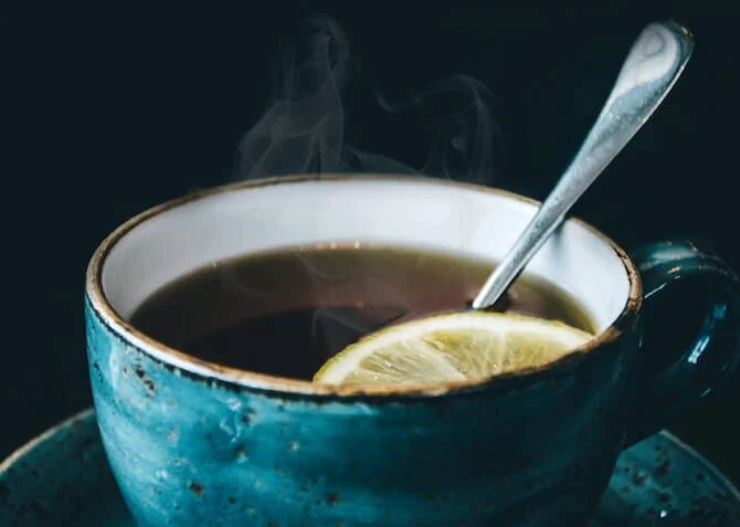 cup of hot team with a slice of lemon