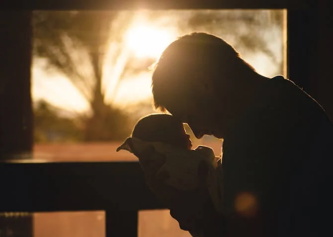 dad and baby at sunset