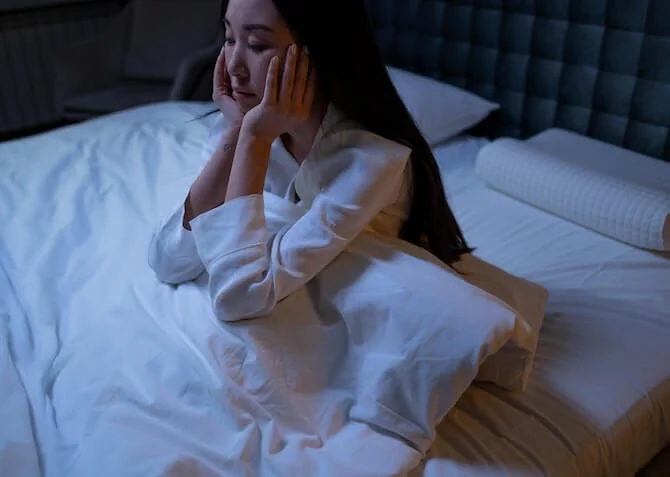 woman with insomnia in bed