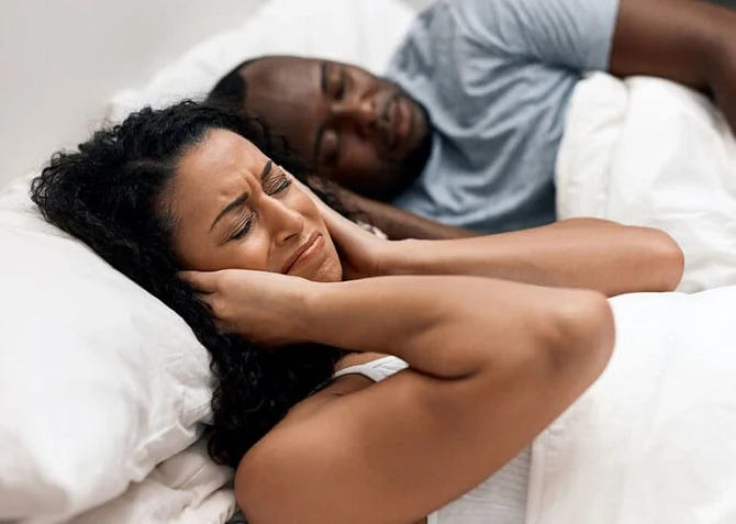 Woman kept awake by snoring partner