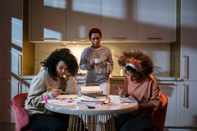 students at dining table revising