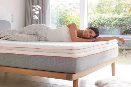 woman laying on a topper