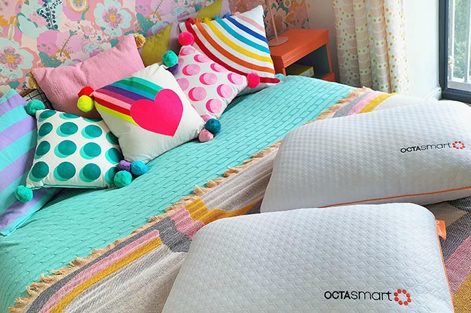 Brightly coloured duvet and pillows on bed